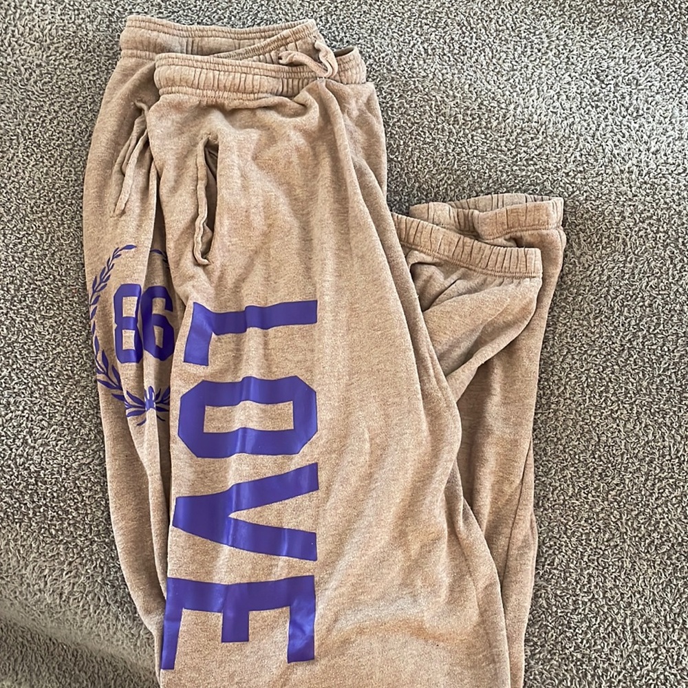 PINK light brown cuffed sweatpants with purple letters